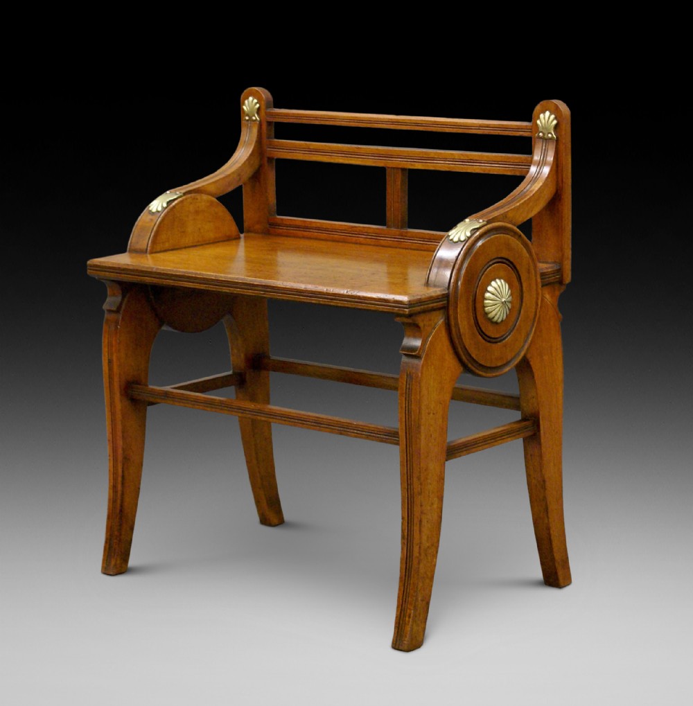 A walnut hall bench by James Shoolbred
