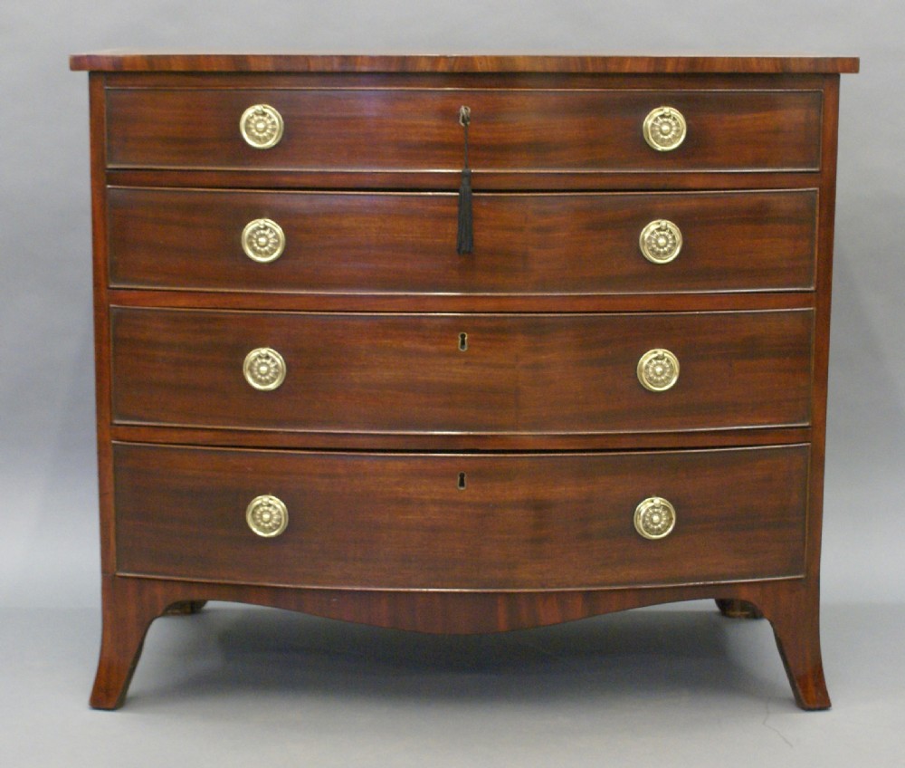 A George III mahogany bow-fronted chest of drawers View II