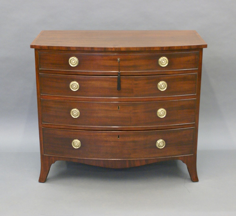A George III mahogany bow-fronted chest of drawers View IV