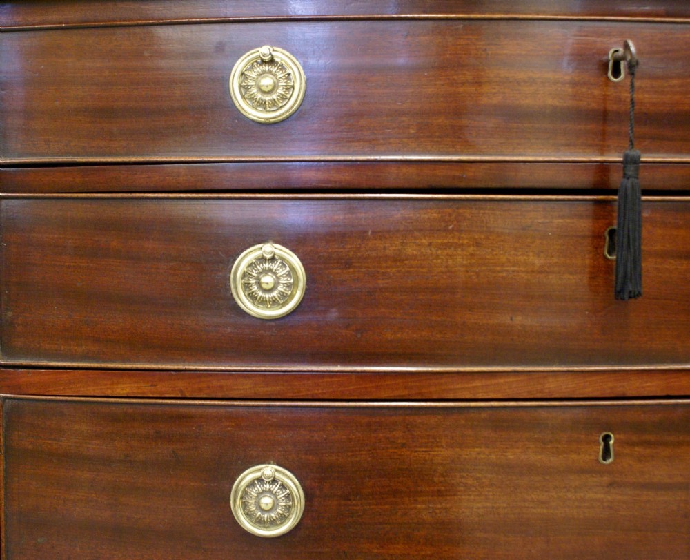 A George III mahogany bow-fronted chest of drawers View VI