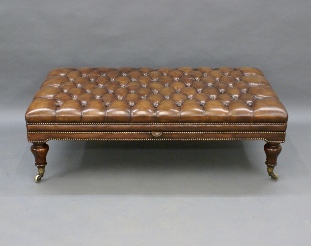 A very large leather upholstered stool View II