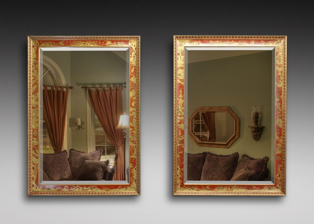 A pair of Chinoiserie, red japanned mirrors