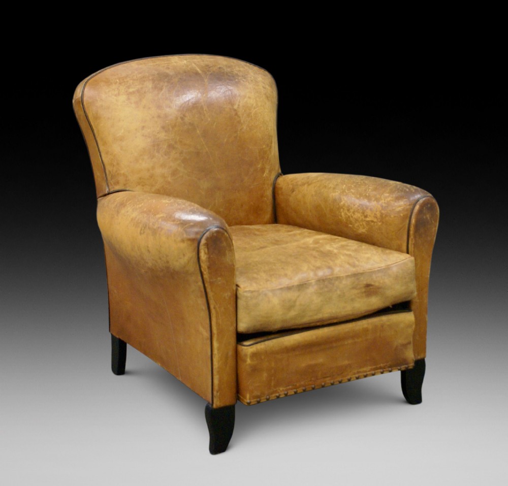 A leather upholstered arm chair