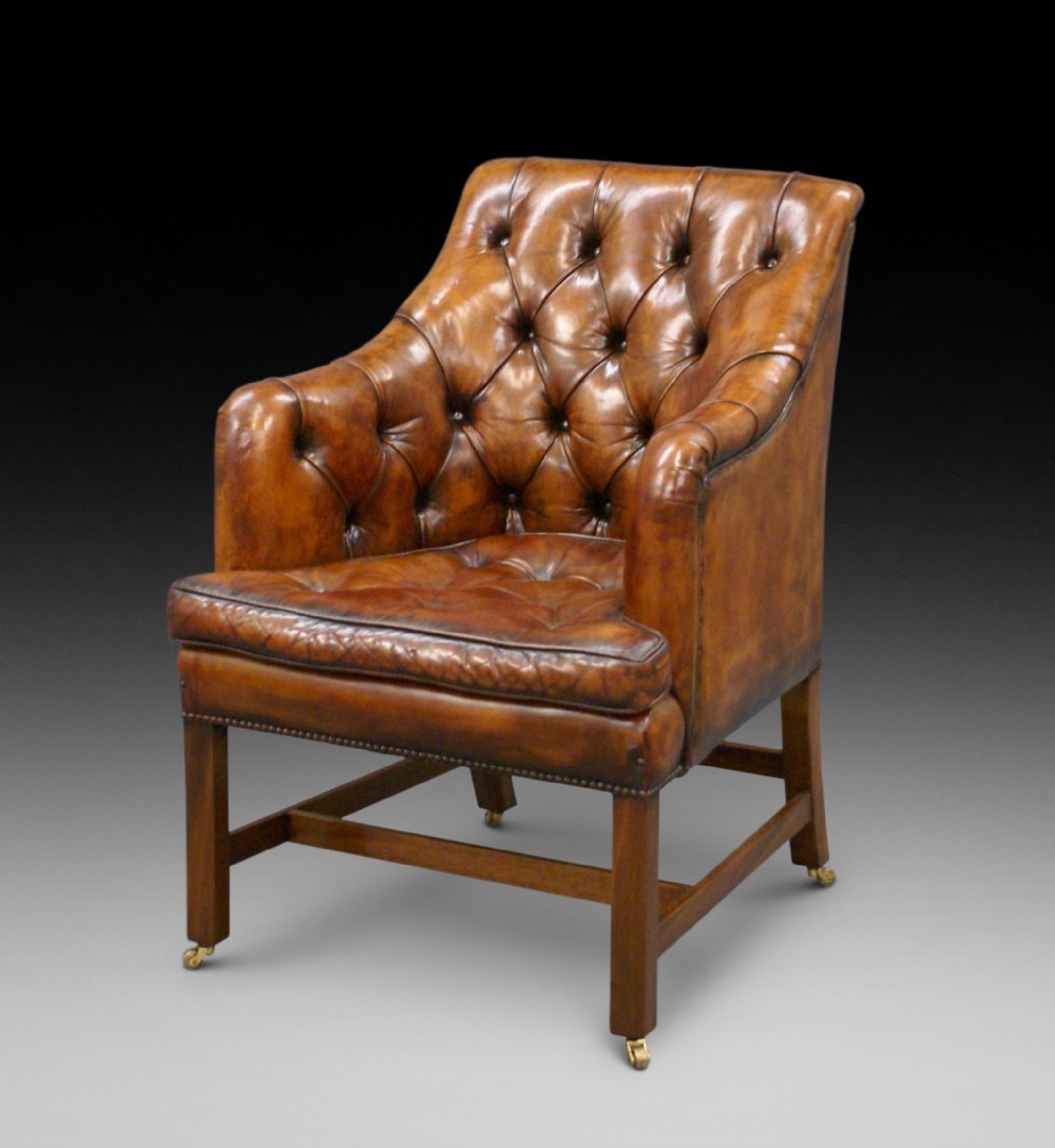 A Georgian style leather arm chair