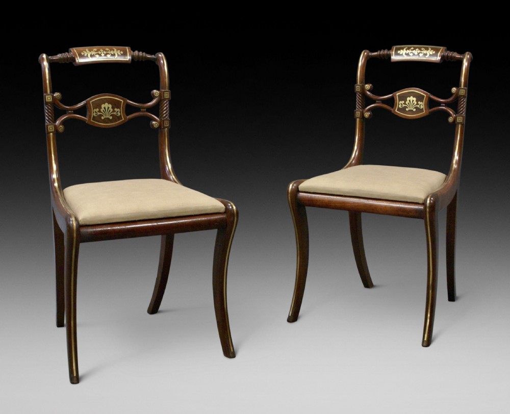 A superb pair of Regency side chairs