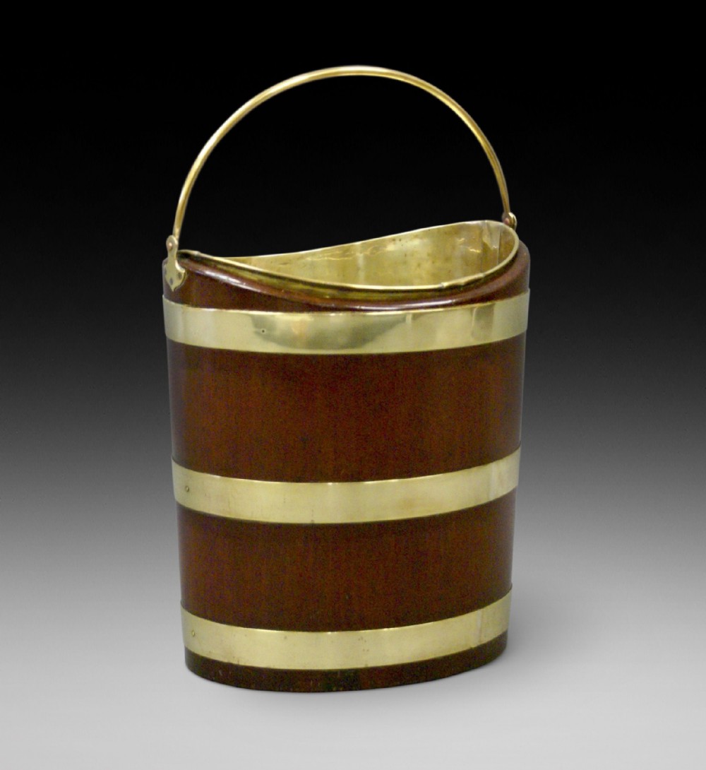 A Dutch mahogany and brass bucket