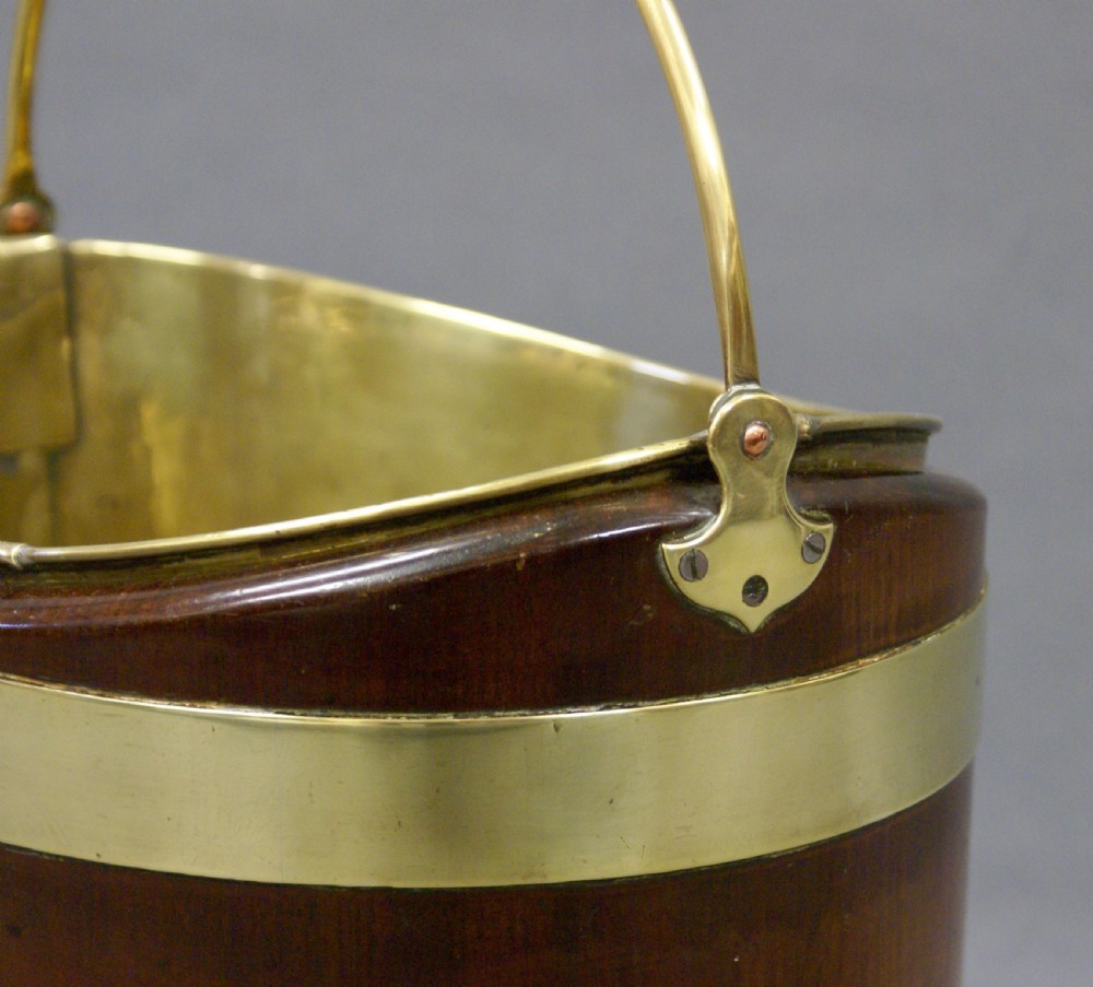 A Dutch mahogany and brass bucket View III
