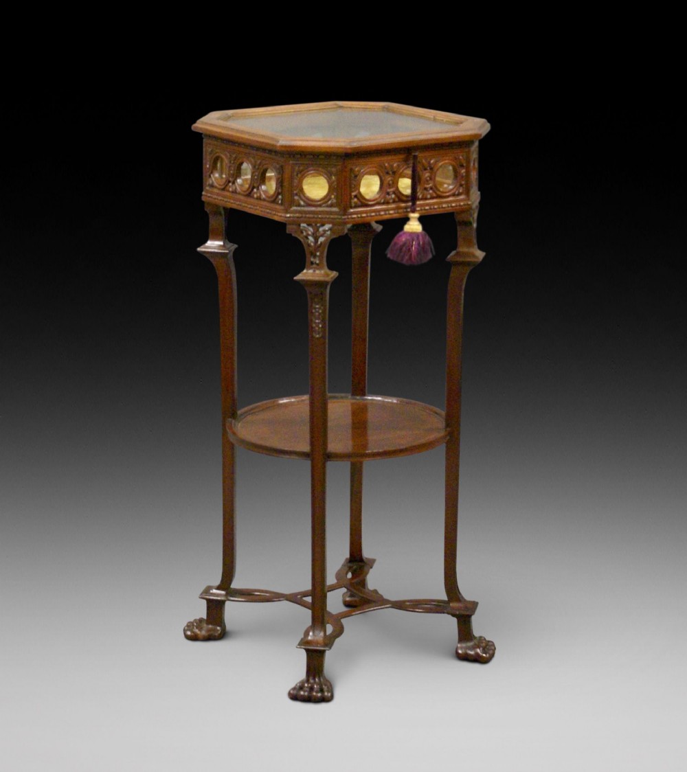 A superb carved mahogany bijouterie table