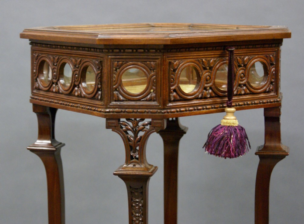 A superb carved mahogany bijouterie table View II