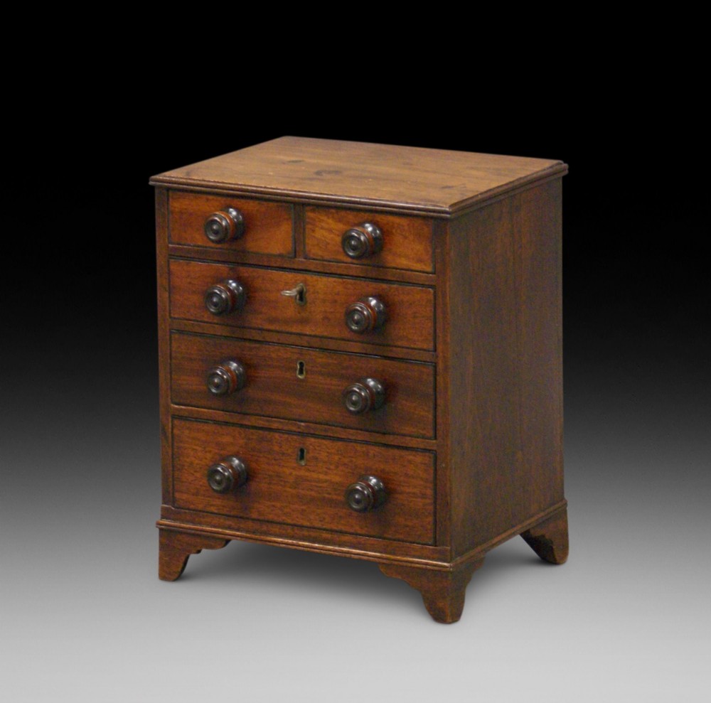A Georgian miniature chest of drawers