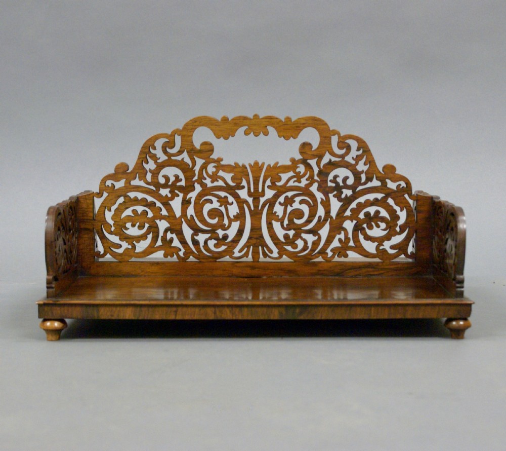 A superb fretted rosewood book carrier