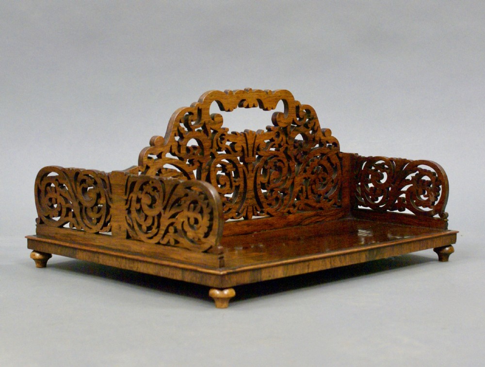 A superb fretted rosewood book carrier View V
