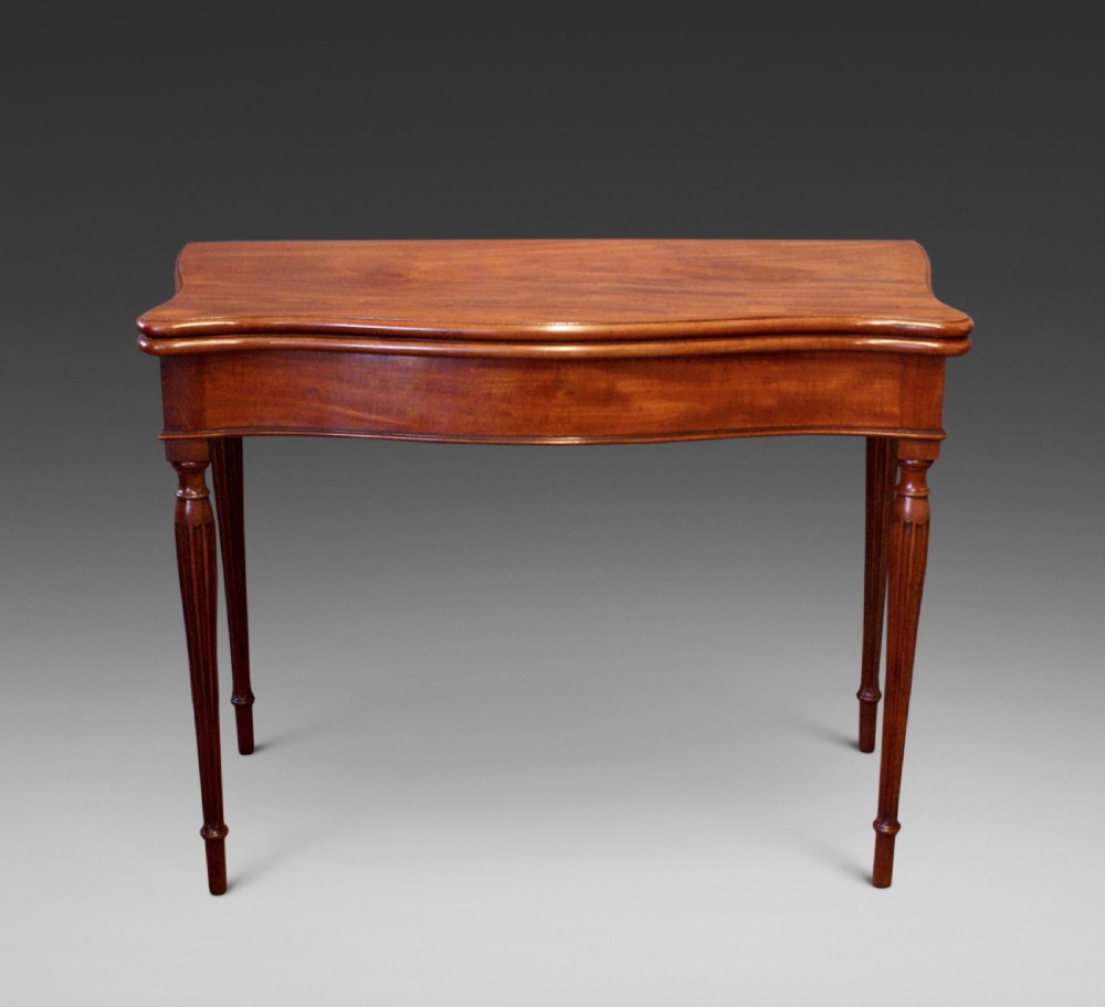 A Hepplewhite period serpentine card table