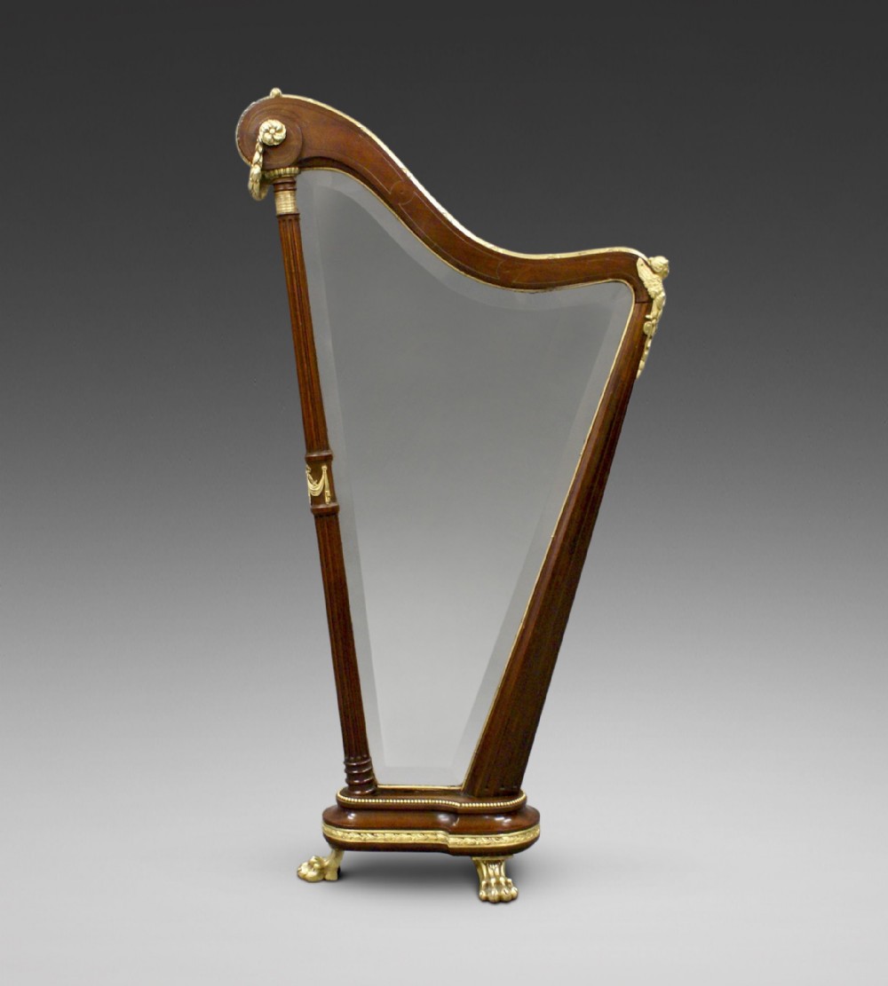 A mahogany & ormolu harp shaped fire screen