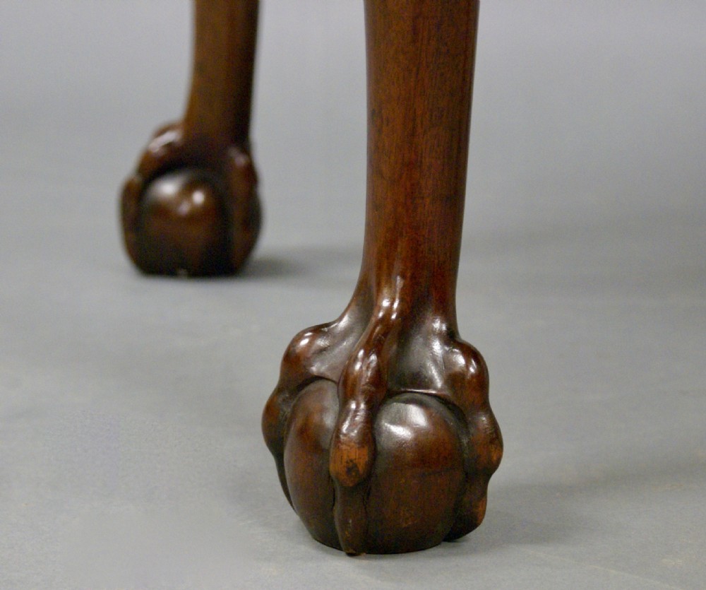 A large carved mahogany oval stool View VI