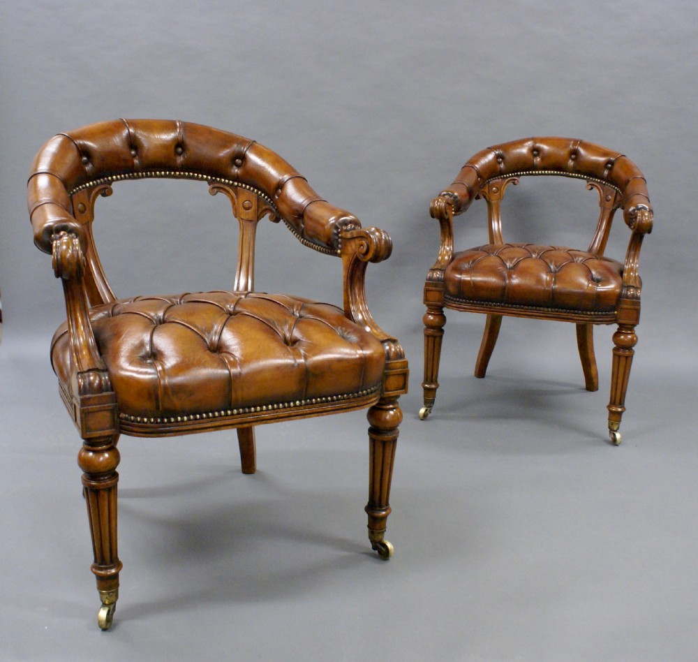 A fine pair of walnut library arm chairs View II