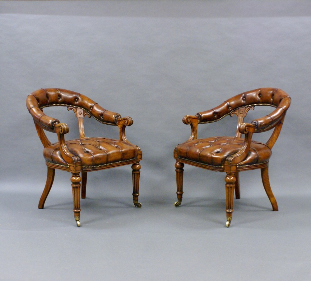A fine pair of walnut library arm chairs View III
