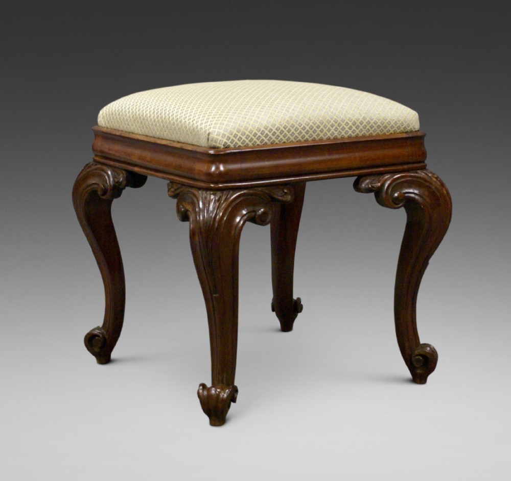 An extravagantly carved rosewood stool