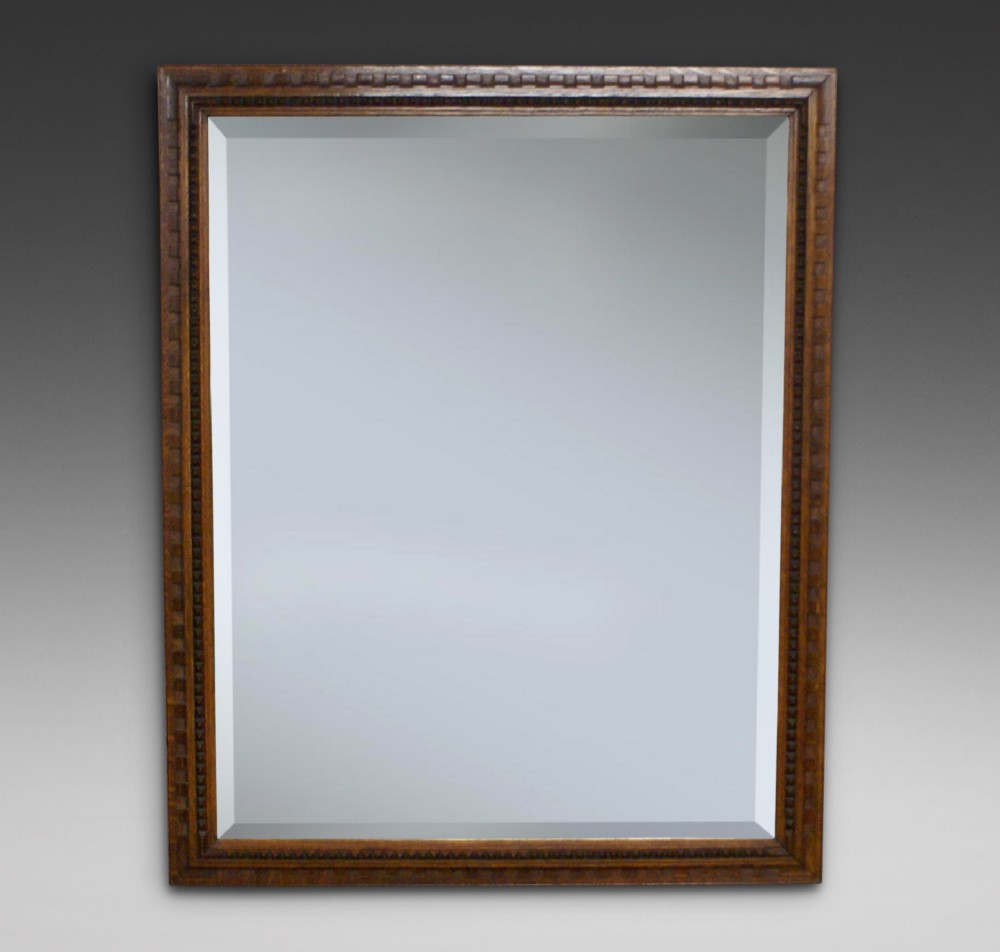A large Arts & Crafts mirror