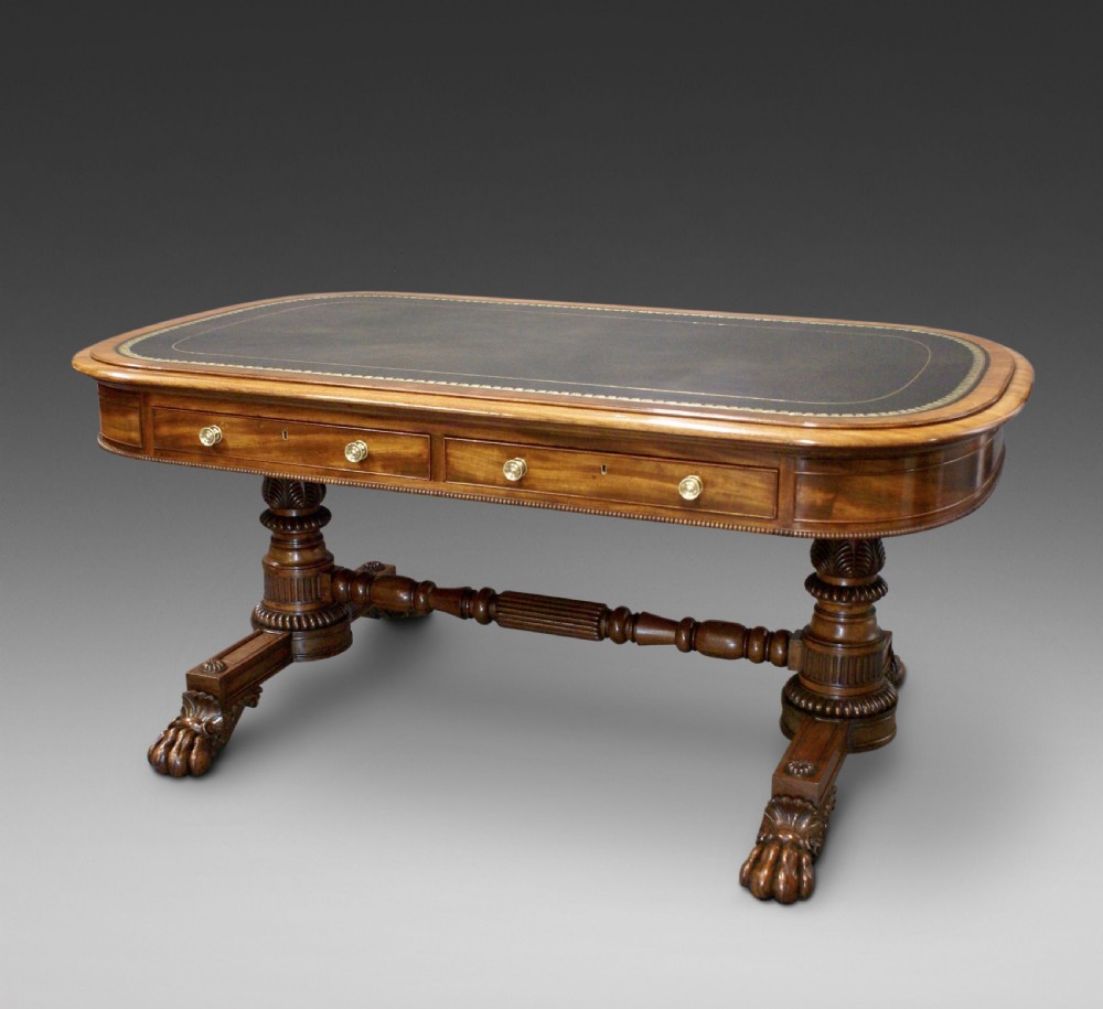 A superb library writing table by Gillows