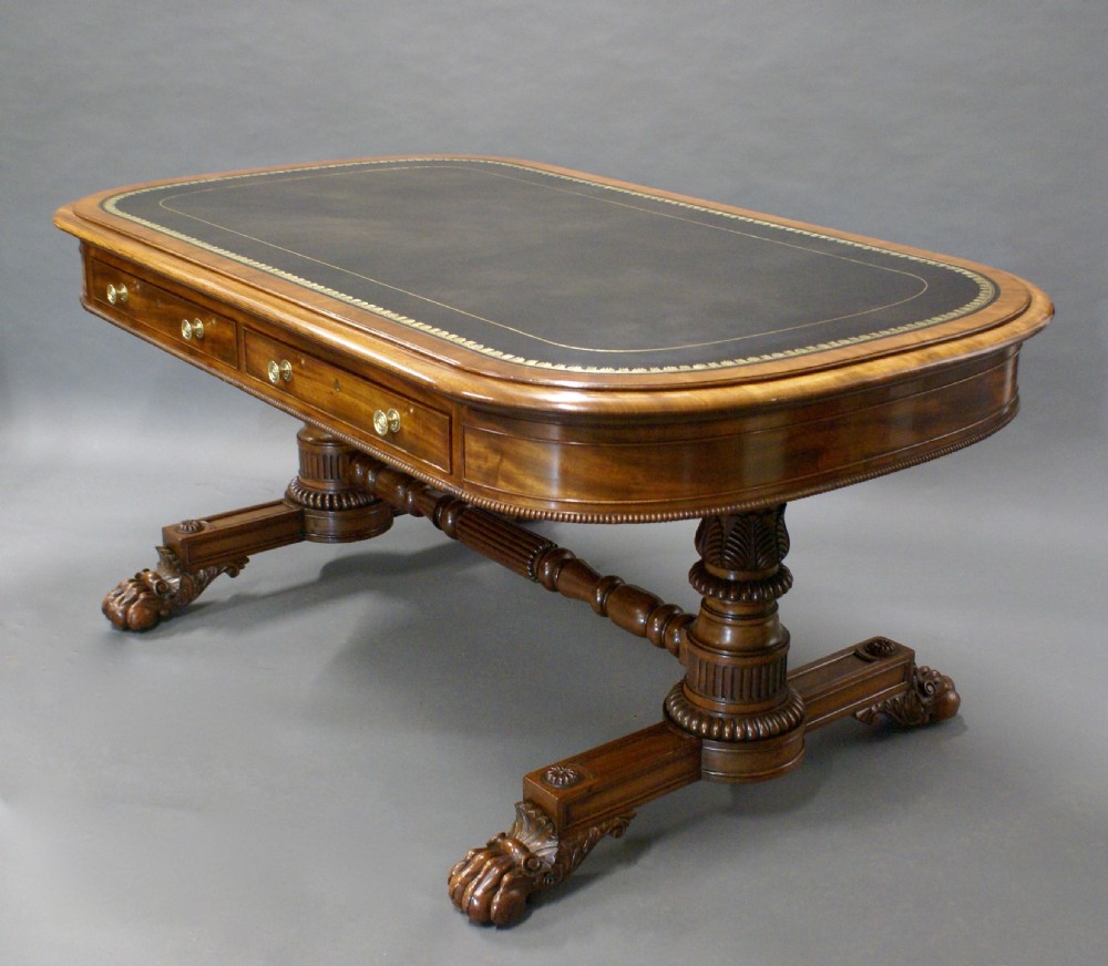 A superb library writing table by Gillows View IV