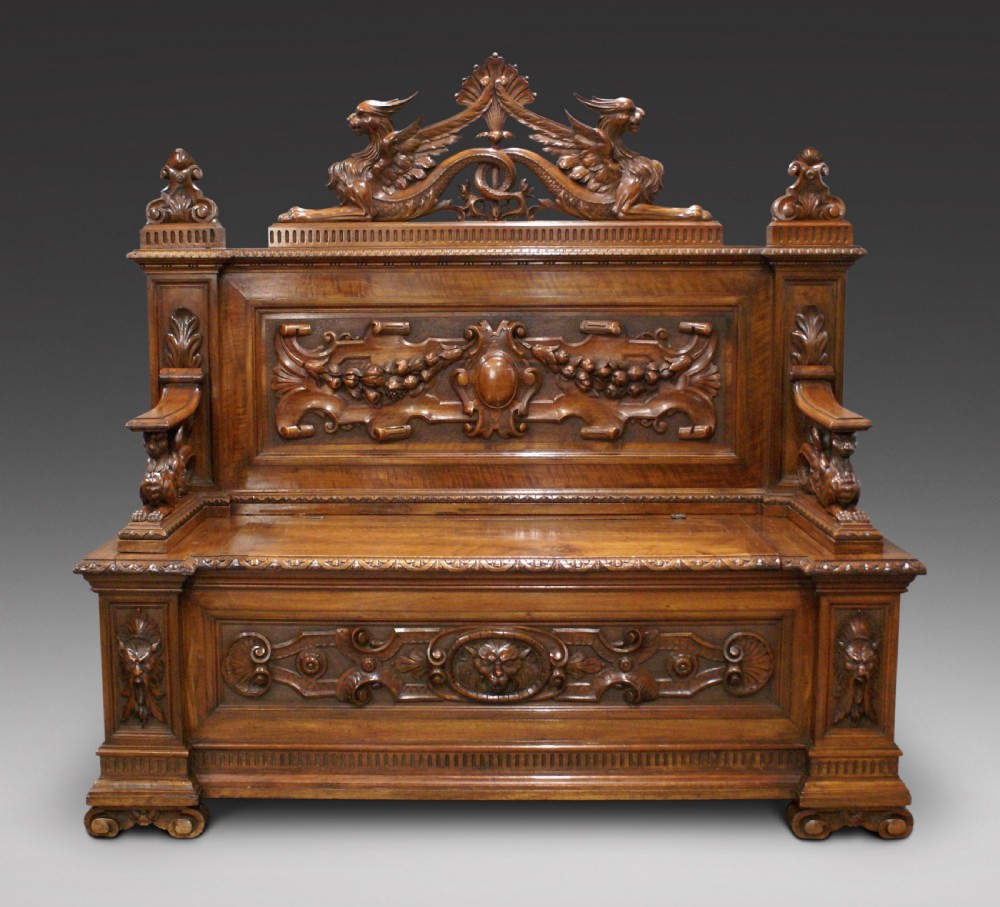 A carved walnut hall bench of exceptional quality
