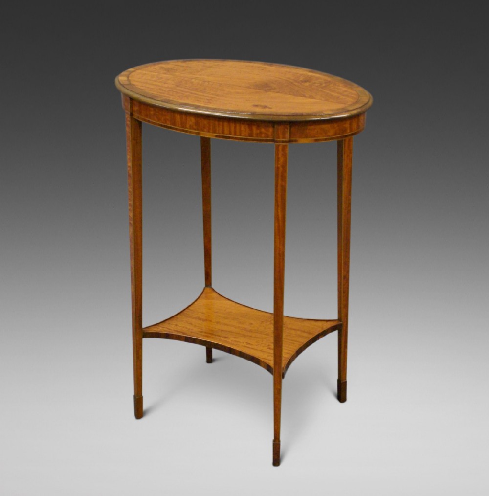 An elegant satinwood occasional table