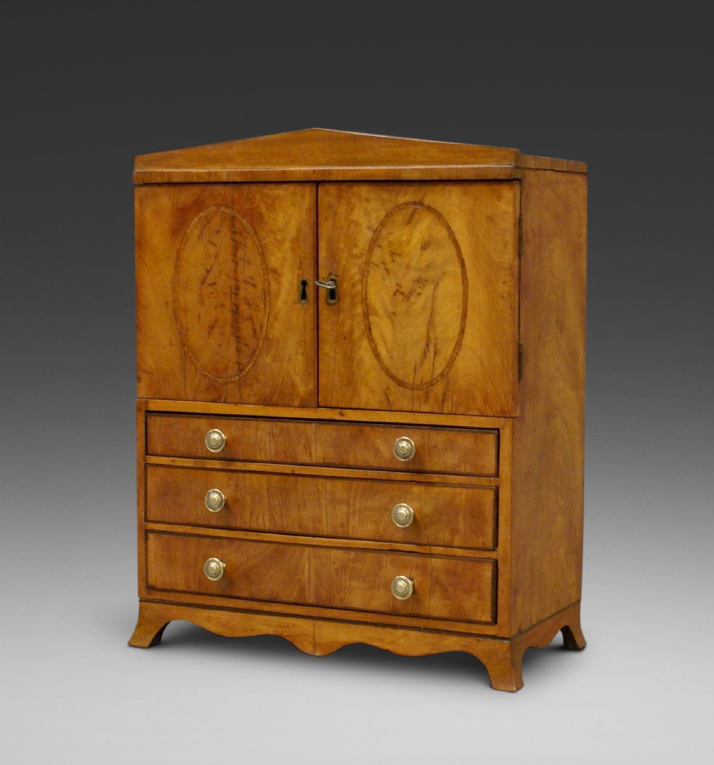A rare Regency miniature satinwood linen press