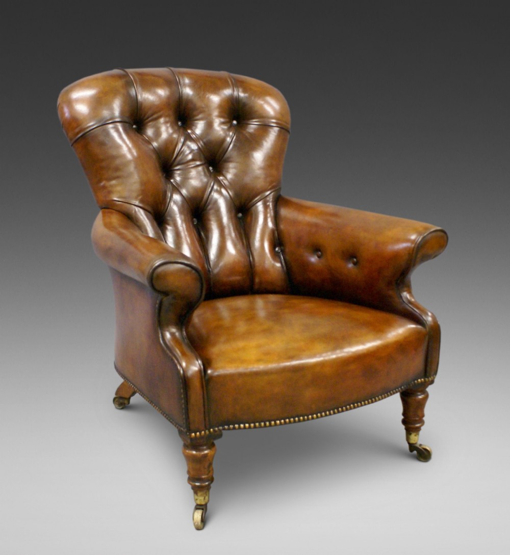A 19thC leather upholstered arm chair