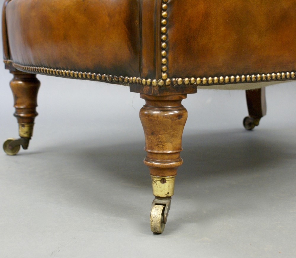 A 19thC leather upholstered arm chair View V