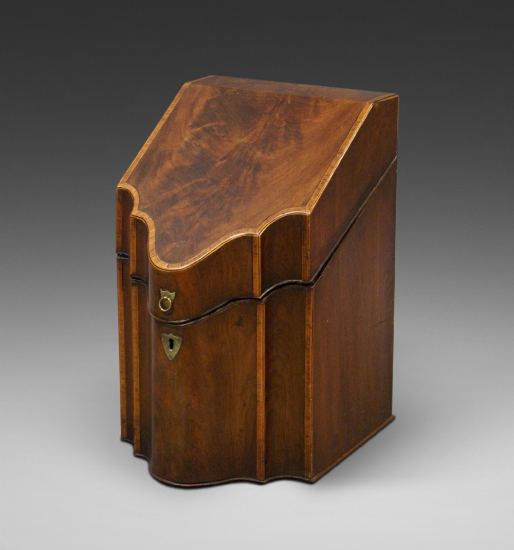 A George III flame mahogany knife box