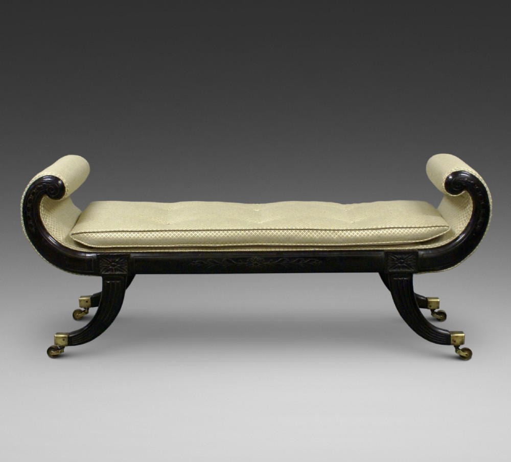 An elegant ebonised window seat