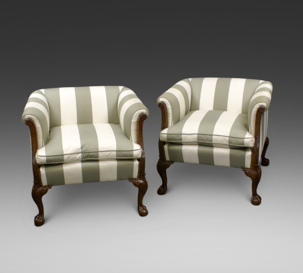 An impressive pair of Edwardian mahogany arm chairs