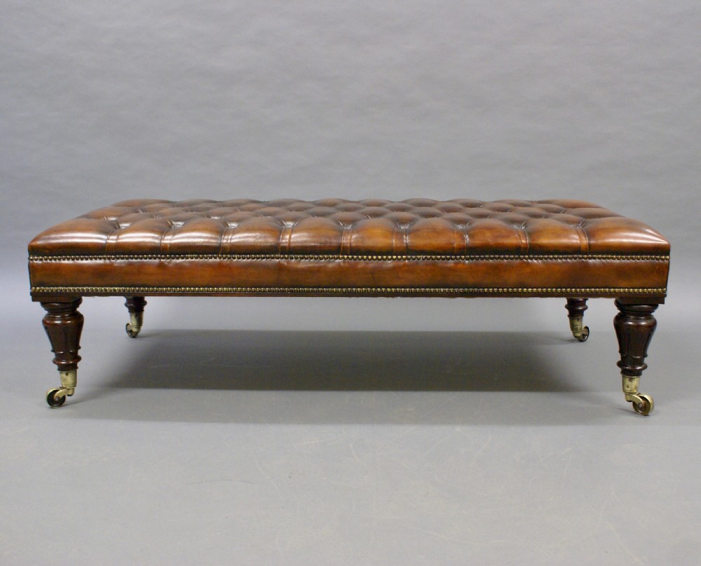 A large rosewood and leather upholstered stool. View II