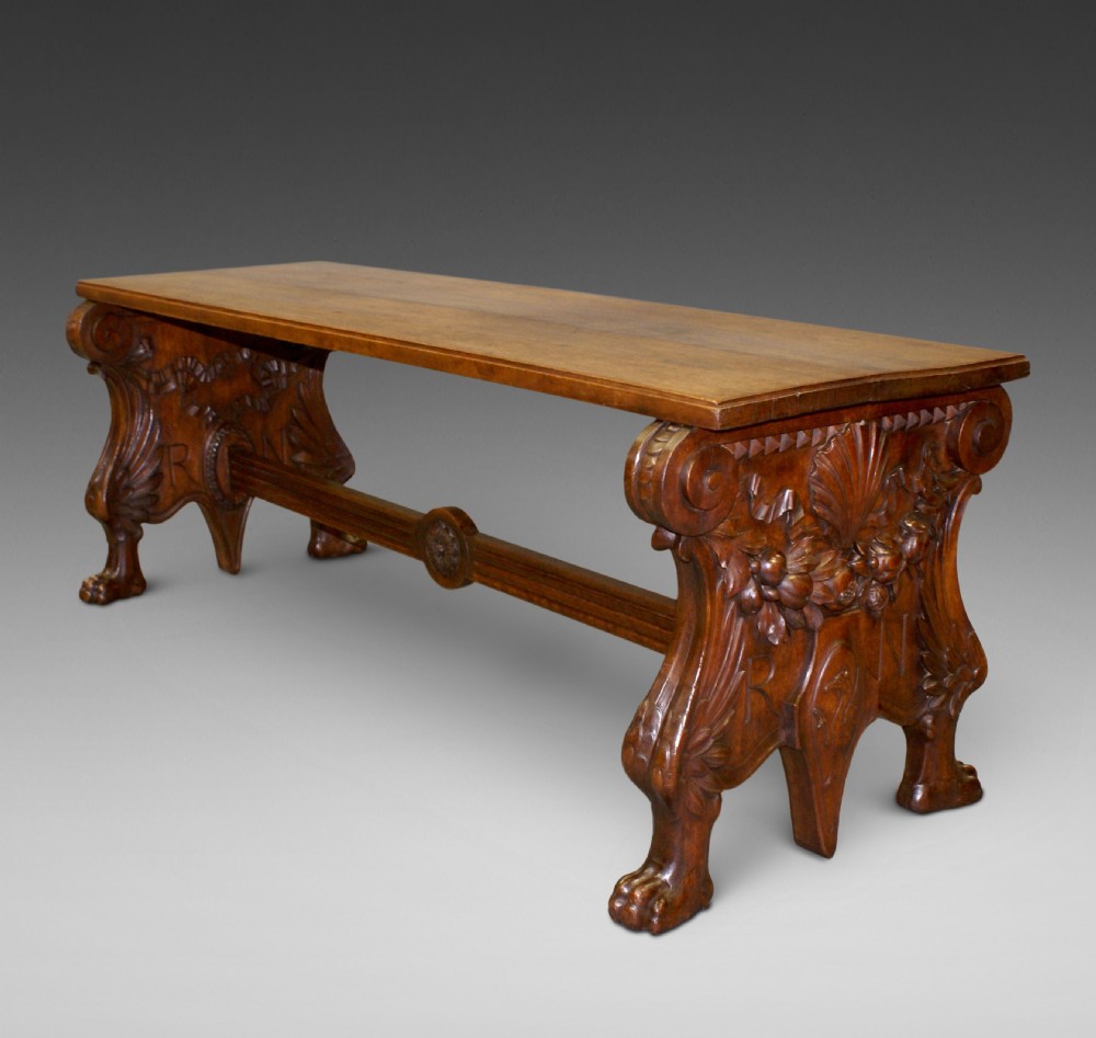 An impressive Italian carved walnut hall bench.