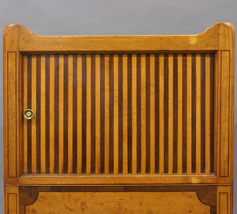An 18th-century George III satinwood tray-top commode featuring a tambour sliding front, cutout gallery handles, single lower drawer, and straight square legs. View III