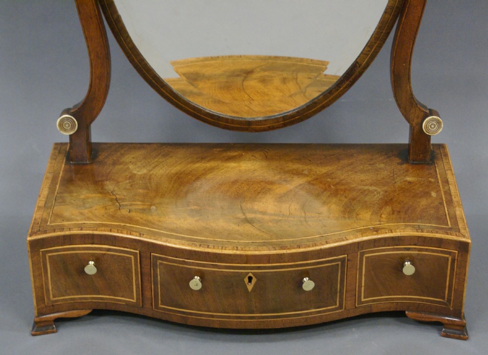 A George III mahogany toilet mirror View V