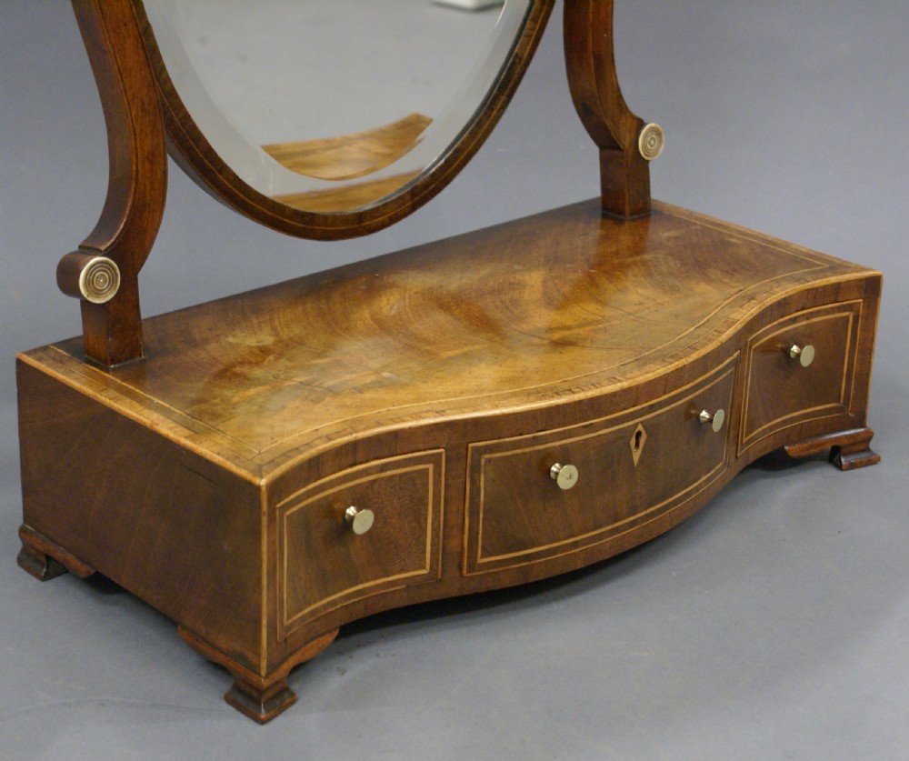 A George III mahogany toilet mirror View VI