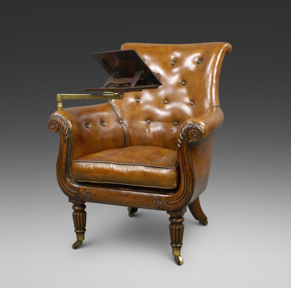 A Regency leather upholstered reading chair