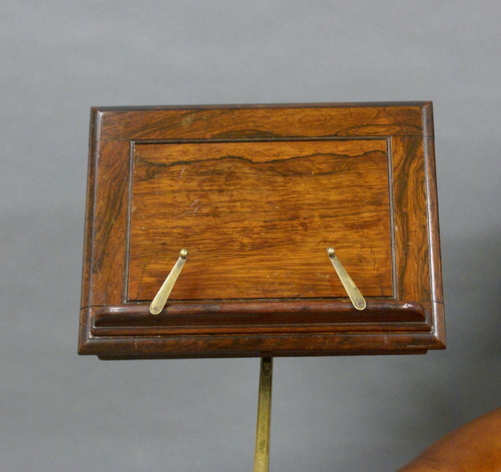 A Regency leather upholstered reading chair View VI