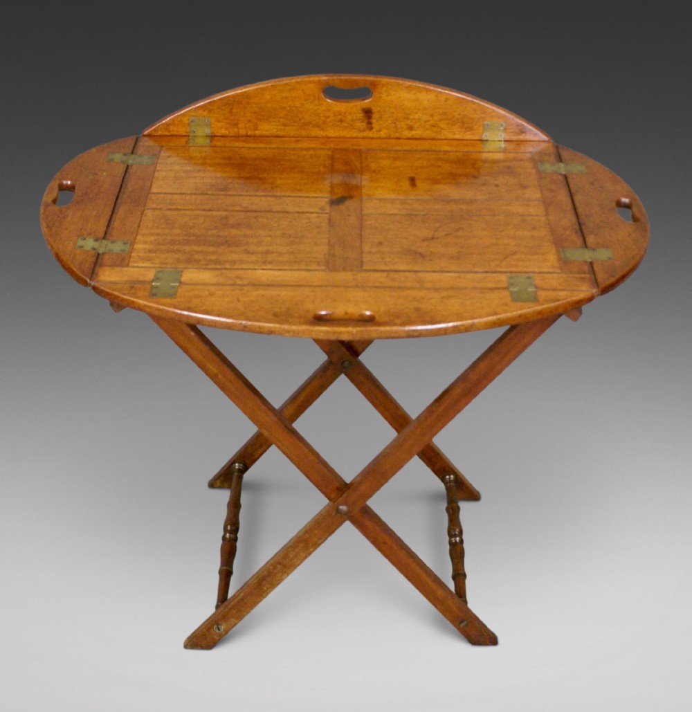 A 19thC mahogany folding butlers tray on stand