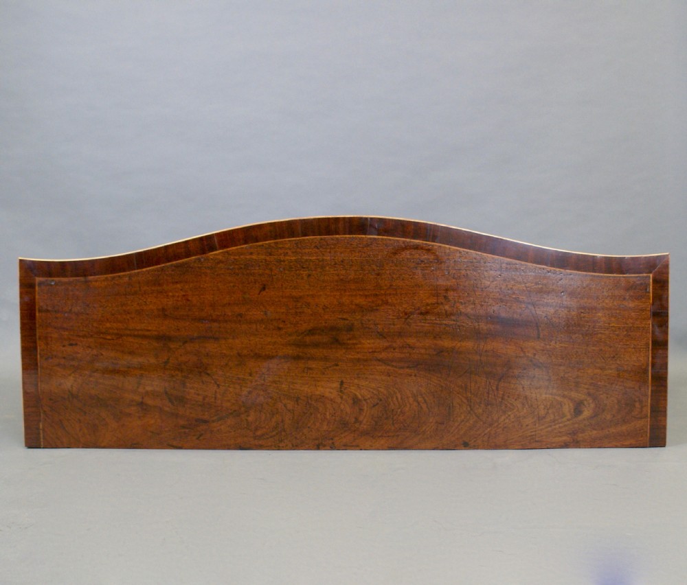 A George III serpentine side cabinet View IV