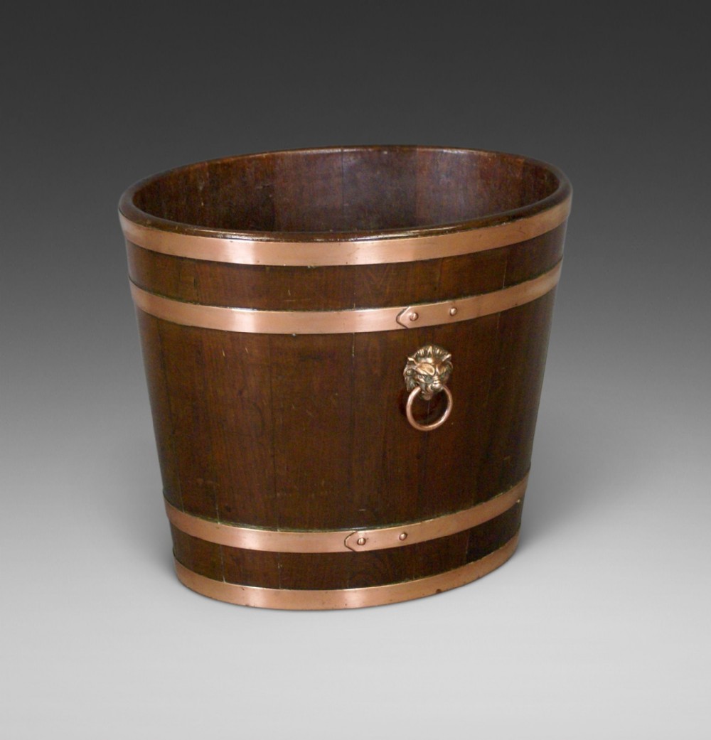 A 19thC mahogany oval bucket