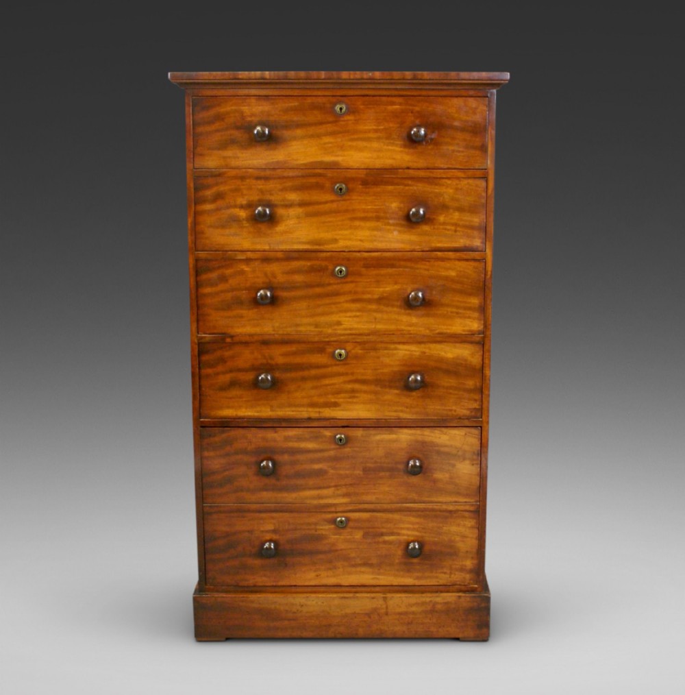 A late Regency tall mahogany chest