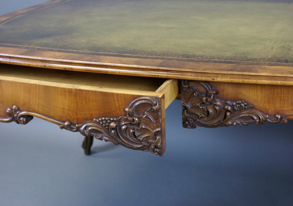 A large 19thC French walnut writing table View VI