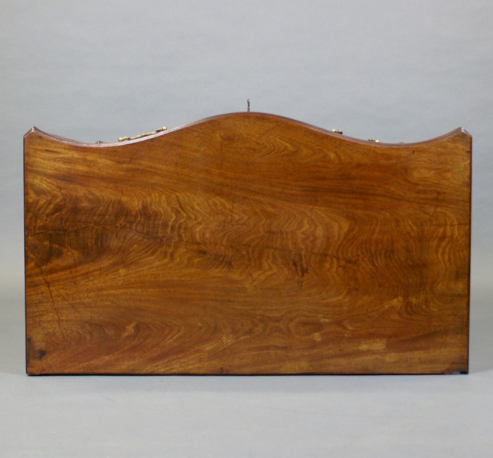 A Hepplewhite period serpentine chest of drawers View III
