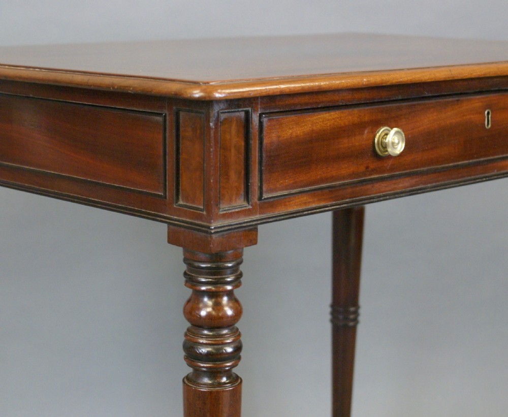 A Victorian mahogany chamber writing table with a single frieze drawer, brass knob handles, turned legs, and brass castors. View VII