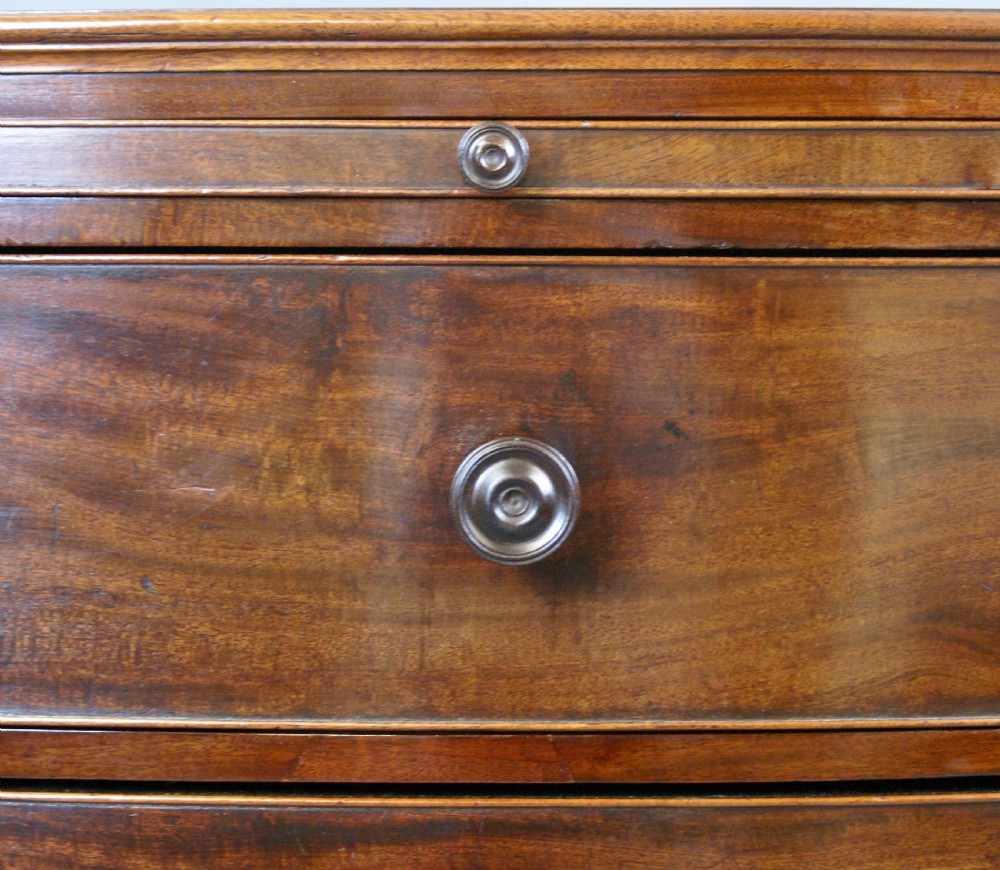 A George III mahogany bow-fronted chest. View VI