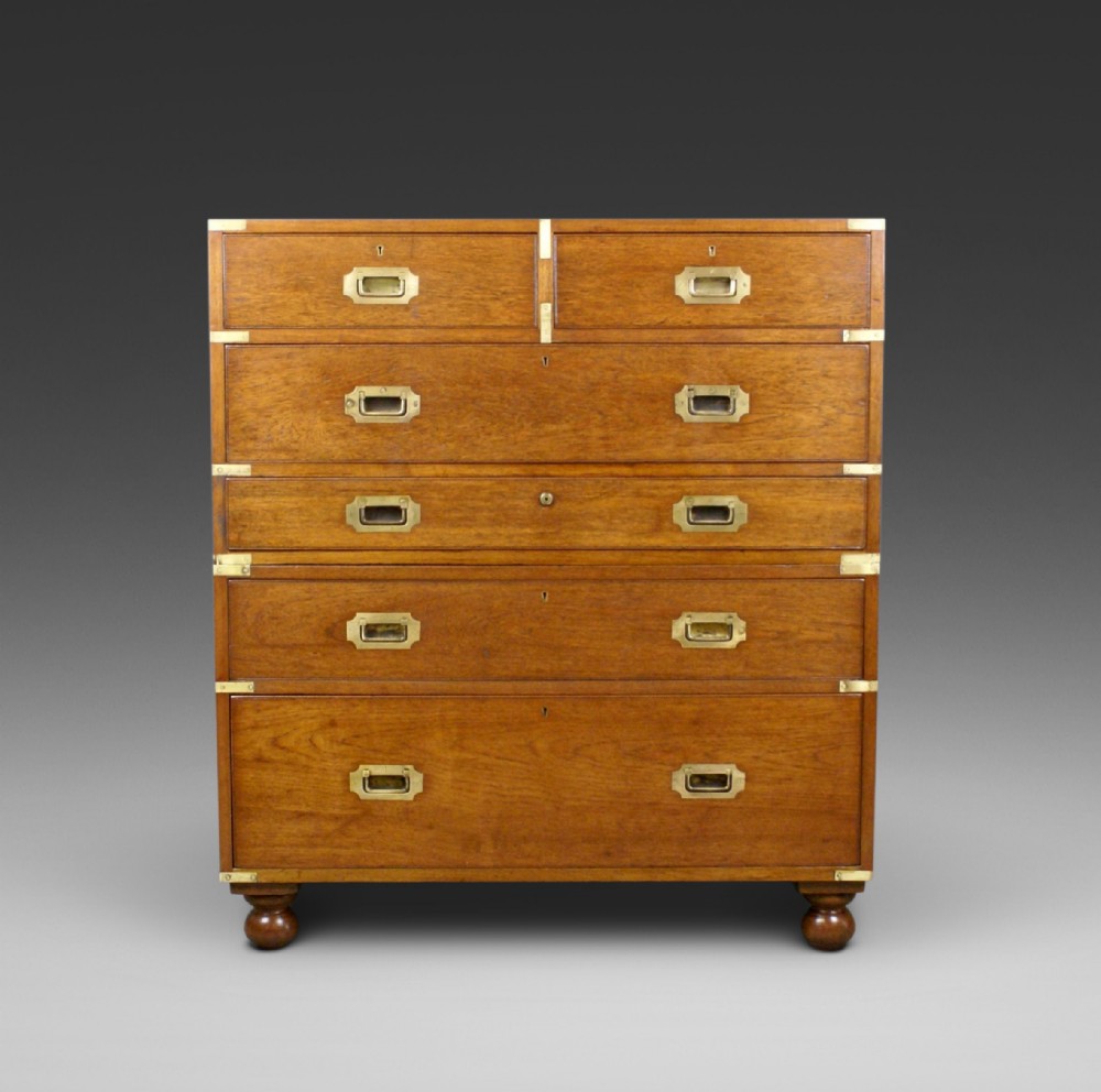 A solid teak secretaire military chest