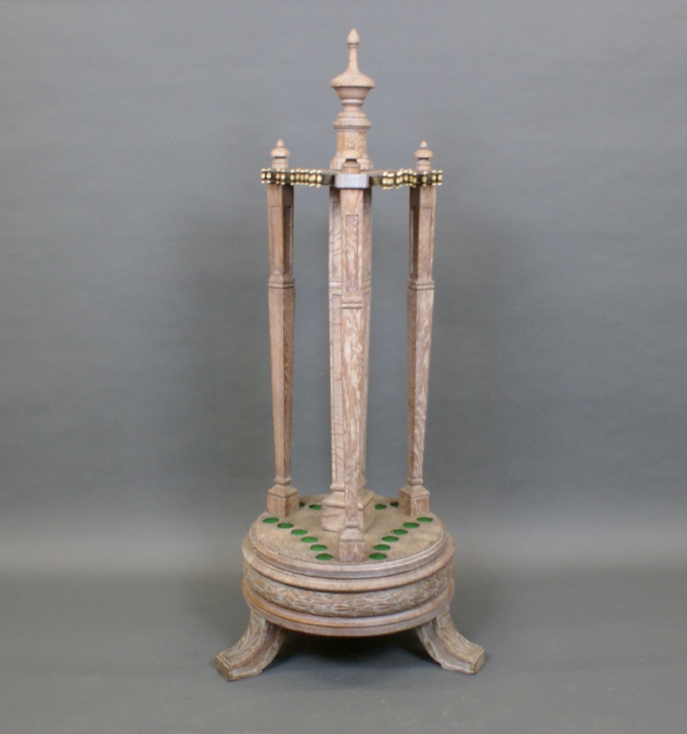 An Edwardian limed oak snooker cue stand